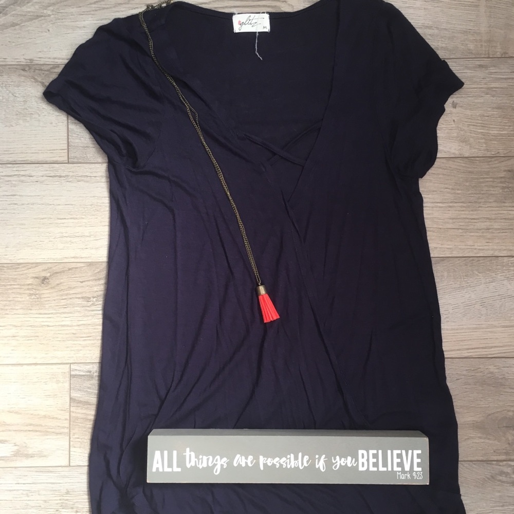 Size medium but fits like a small. Lightly worn